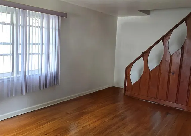 a view of an entryway with wooden floor