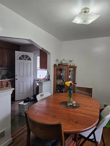 a dining room with a table and chairs