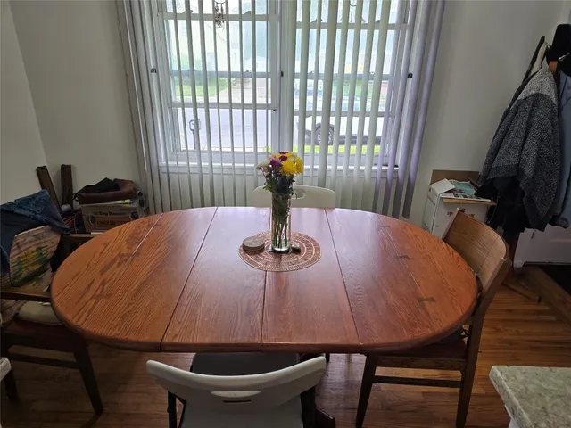 a view of a dining room with furniture and window