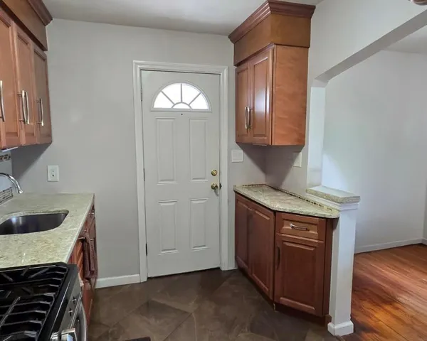 a kitchen with a stove and a sink