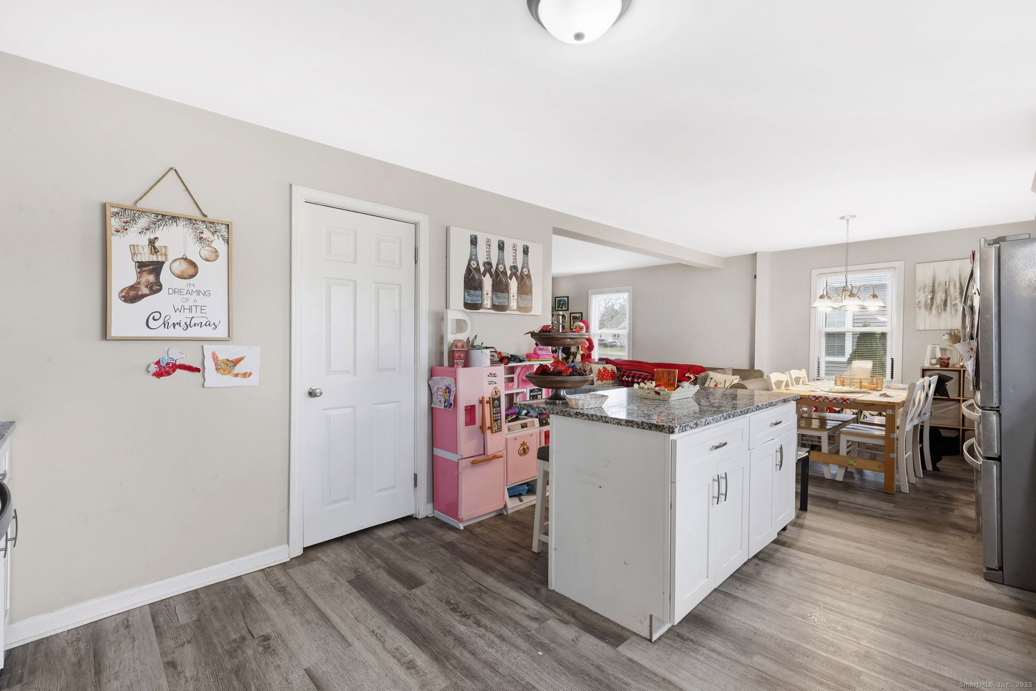16 Brainard Road Enfield, CT 06082 - Photo 11 of 28 a kitchen with a stove and wooden floor