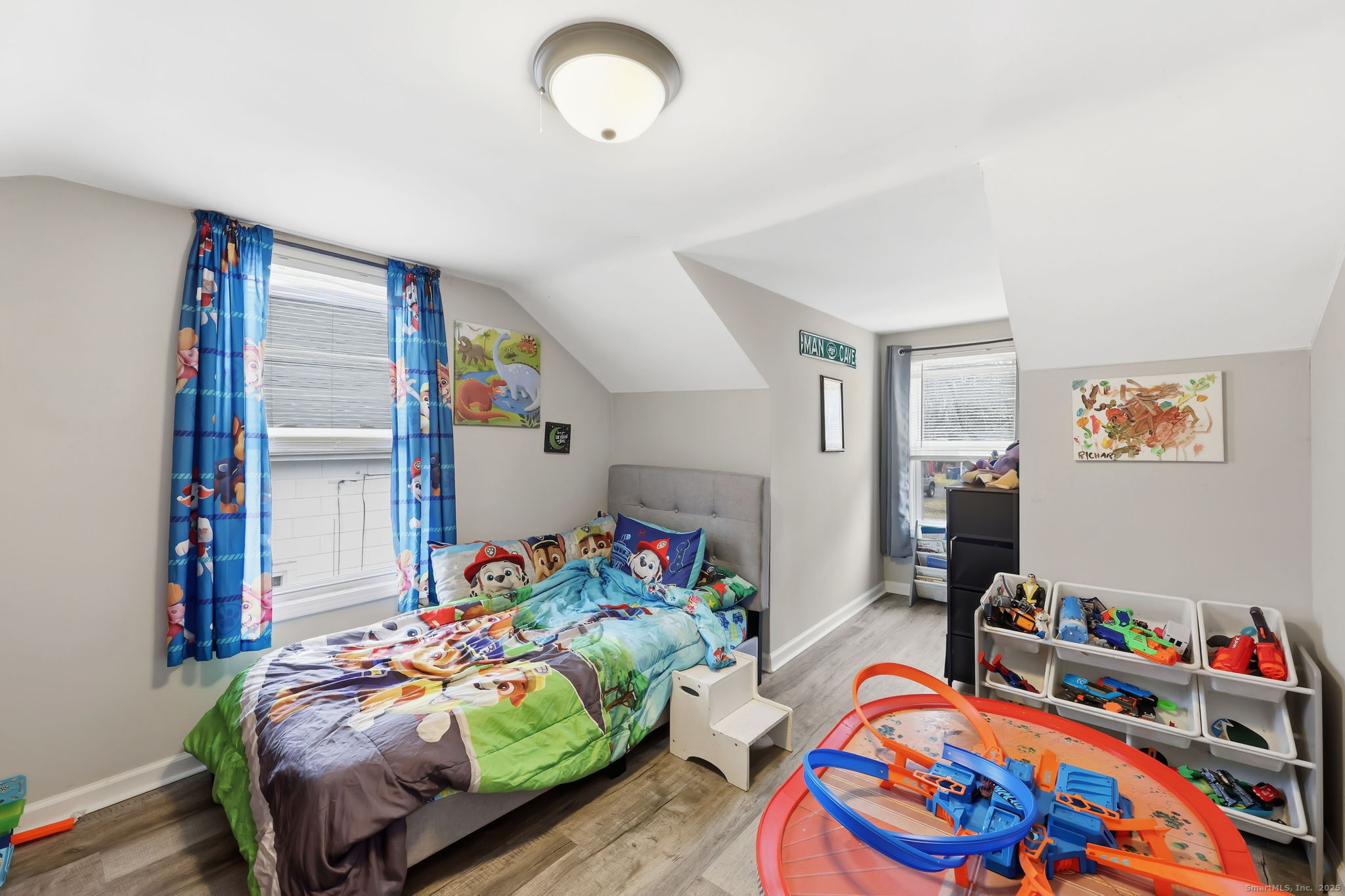 16 Brainard Road Enfield, CT 06082 - Photo 18 of 28 a bedroom with bed and a wooden floor