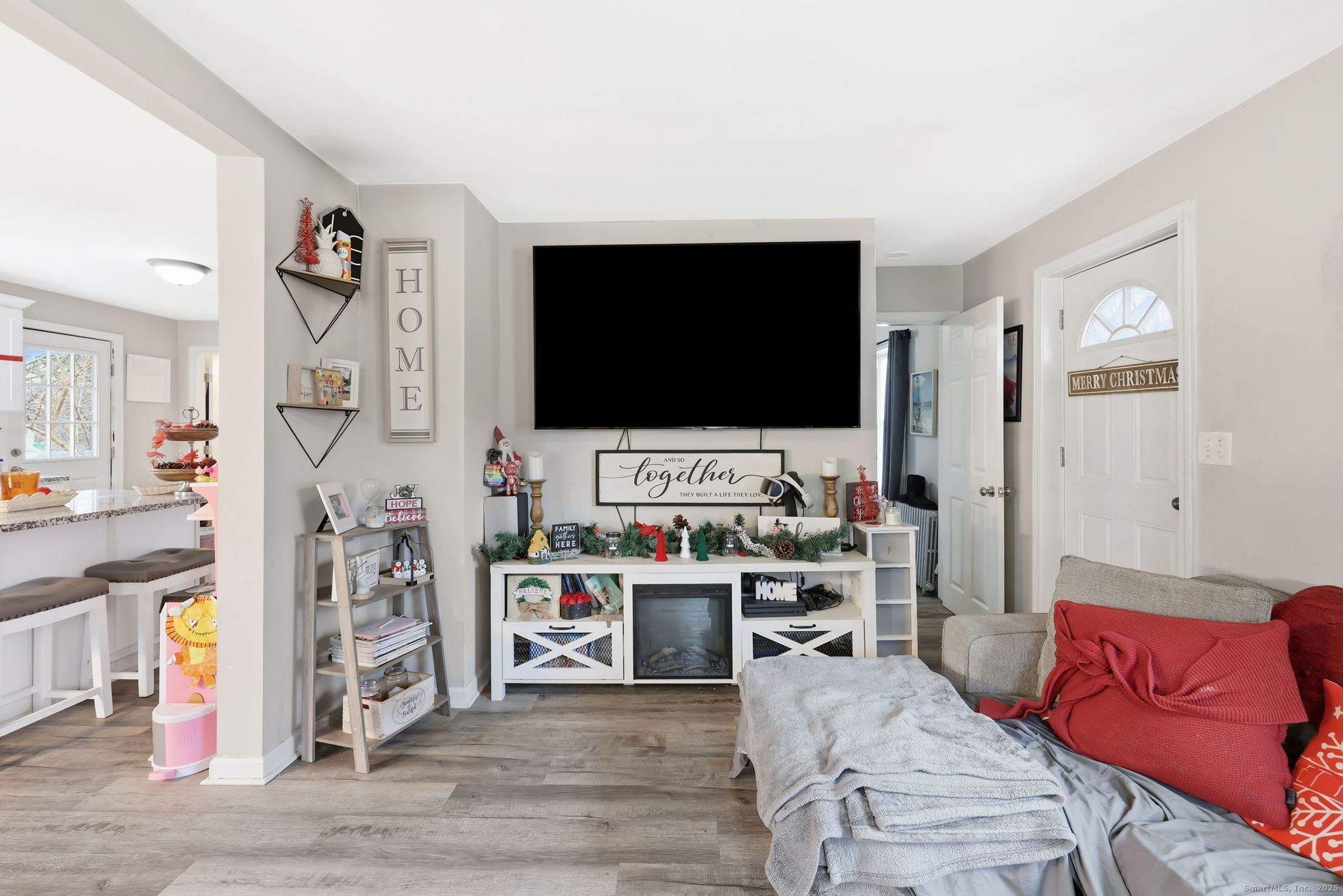 16 Brainard Road Enfield, CT 06082 - Photo 8 of 28 a living room with furniture and a flat screen tv