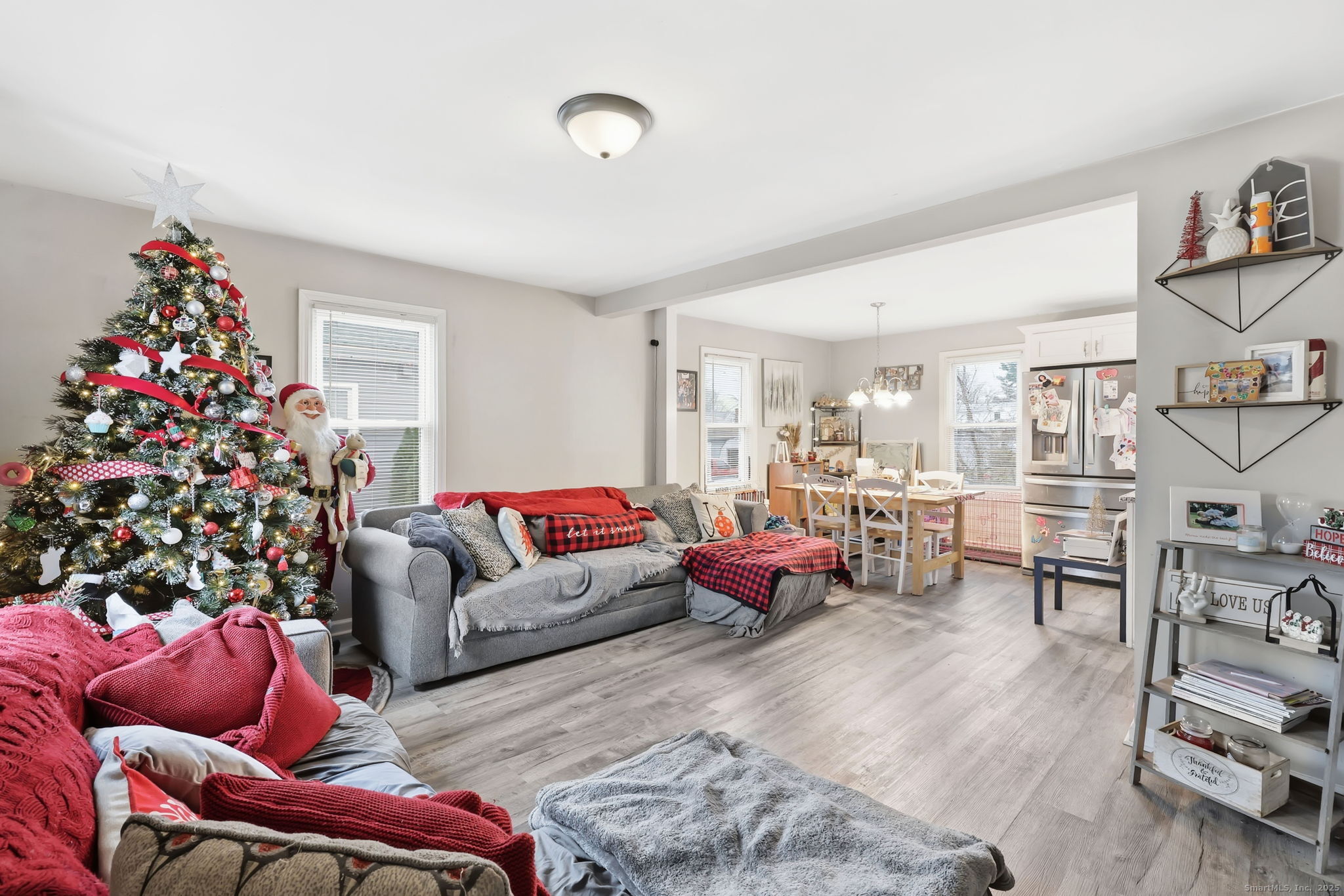 16 Brainard Road Enfield, CT 06082 - Photo 9 of 28 a living room with furniture a flowers and a window