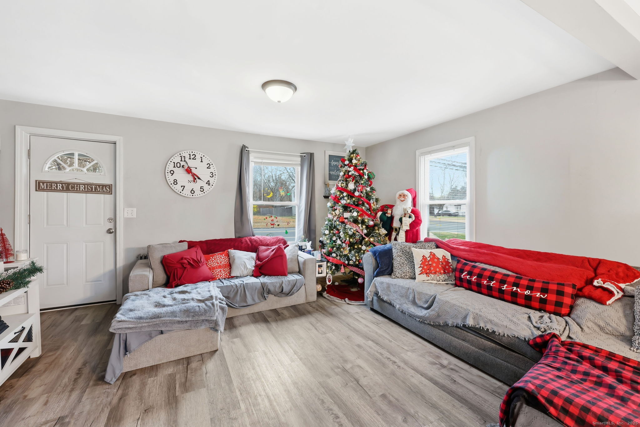 16 Brainard Road Enfield, CT 06082 - Photo 10 of 28 a living room with furniture and flowers