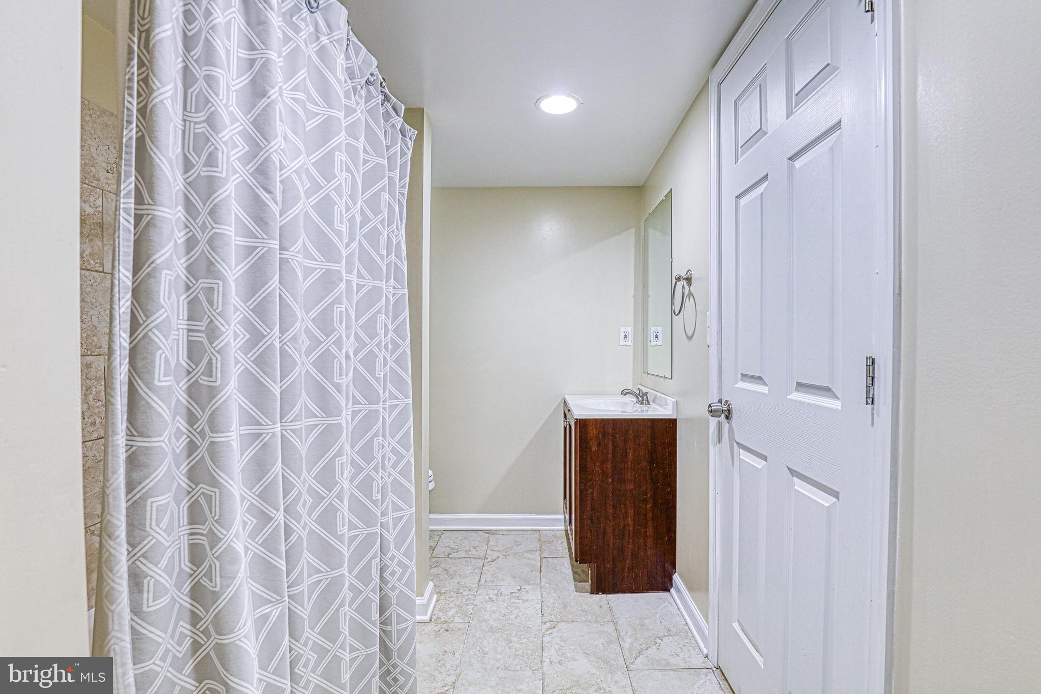 7813 E Road Pasadena, MD 21122 - Photo 26 of 31 Lower Level Bath (Full Bath #2)
