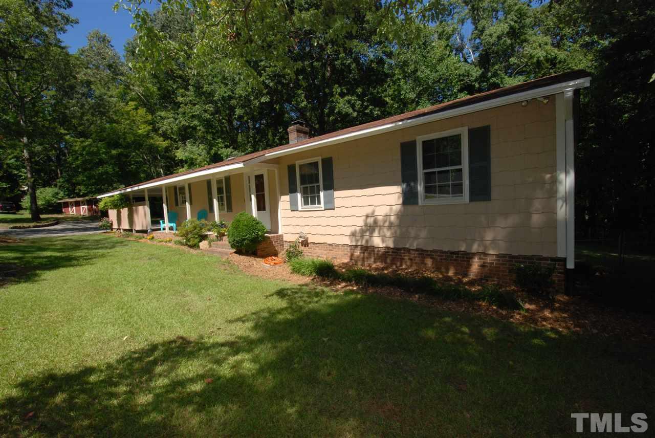 6908 Lake Wheeler Road Raleigh, NC 27603 - Photo 1 of 25 a view of a house with backyard and garden