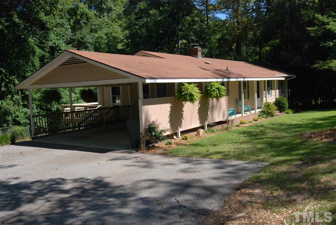6908 Lake Wheeler Road Raleigh, NC 27603 - Photo 2 of 25 a front view of a house with garden