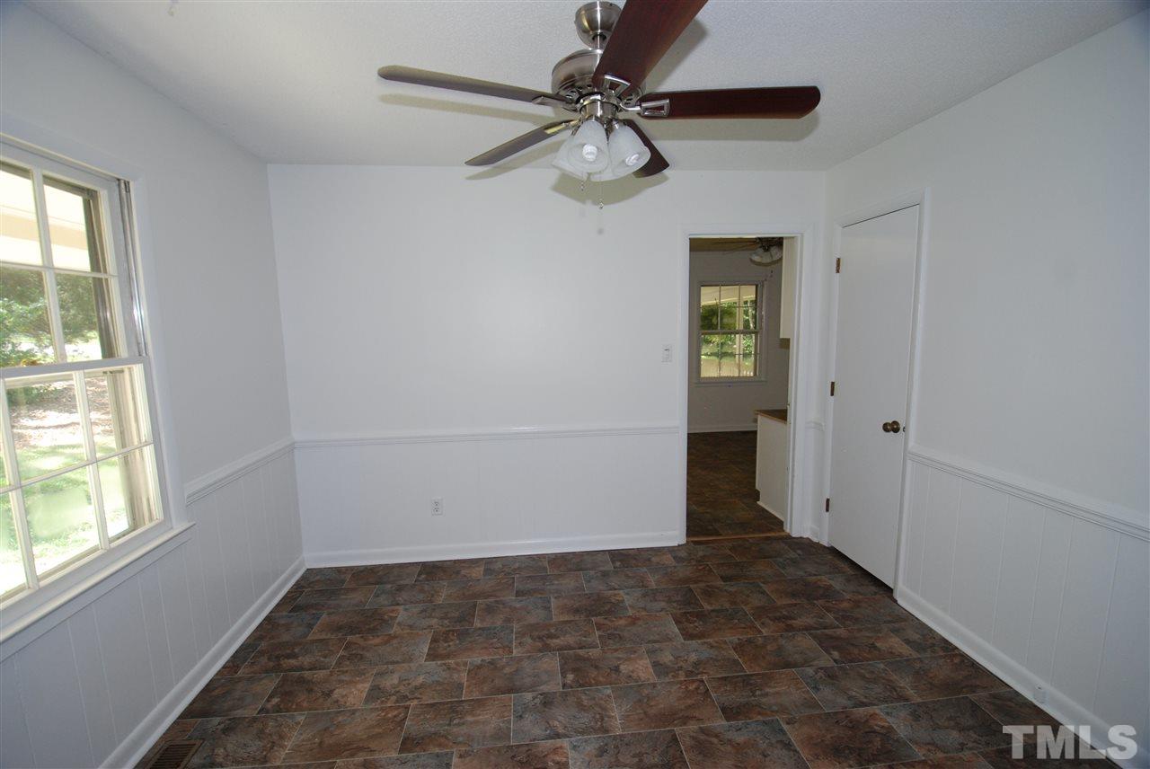 6908 Lake Wheeler Road Raleigh, NC 27603 - Photo 14 of 25 a view of a hallway with a chandelier fan and windows