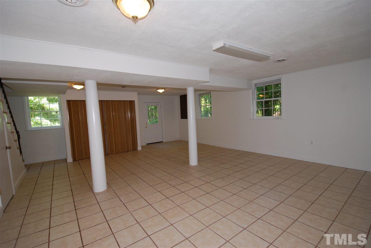 6908 Lake Wheeler Road Raleigh, NC 27603 - Photo 20 of 25 an empty room with windows