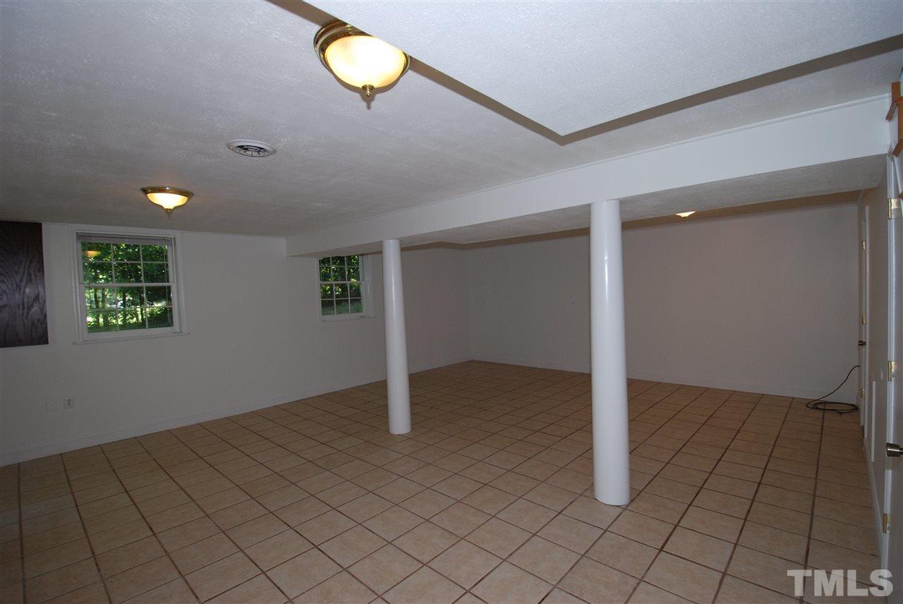 6908 Lake Wheeler Road Raleigh, NC 27603 - Photo 21 of 25 an empty room with windows