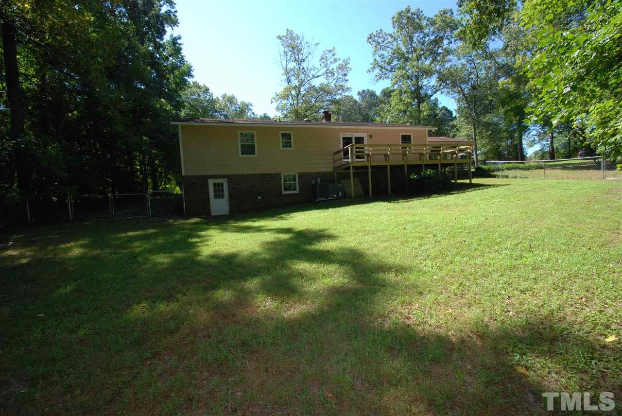 6908 Lake Wheeler Road Raleigh, NC 27603 - Photo 5 of 25 a view of a house with a backyard