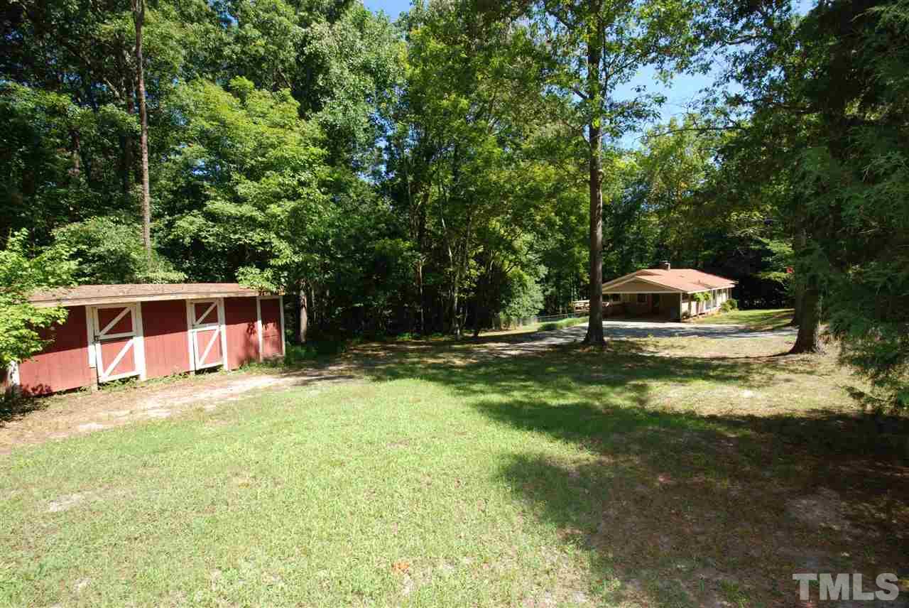 6908 Lake Wheeler Road Raleigh, NC 27603 - Photo 6 of 25 a house view with a sitting space and garden