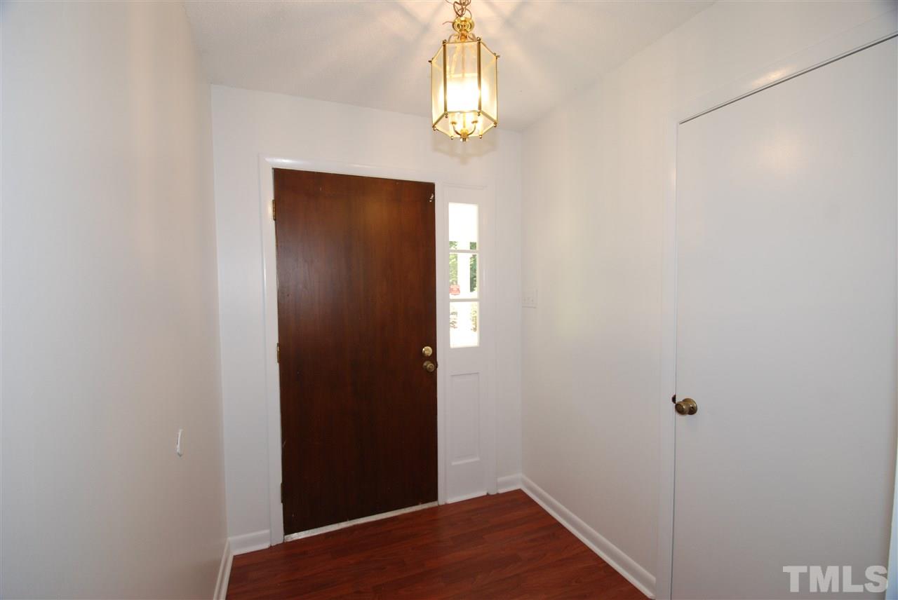 6908 Lake Wheeler Road Raleigh, NC 27603 - Photo 9 of 25 a view of hallway with wooden floor