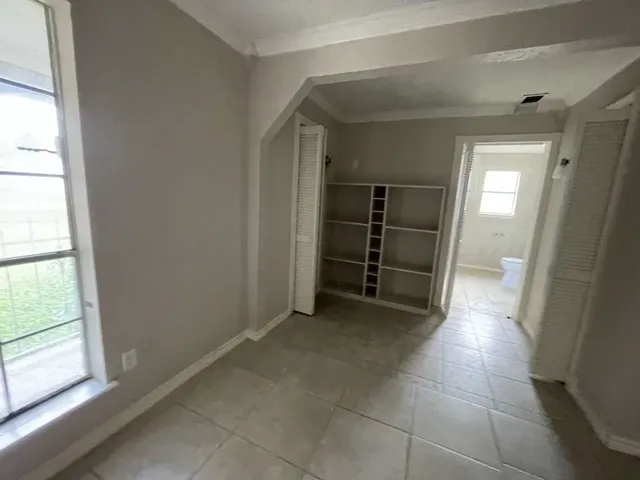 a view of a closet in an empty room