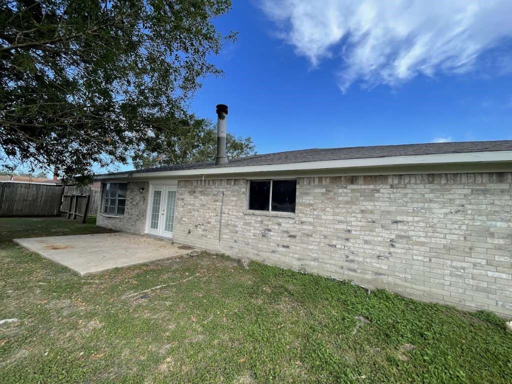 2310 Heather Street Highlands, TX 77562 - Photo 15 of 16 a backyard of a house with lots of green space