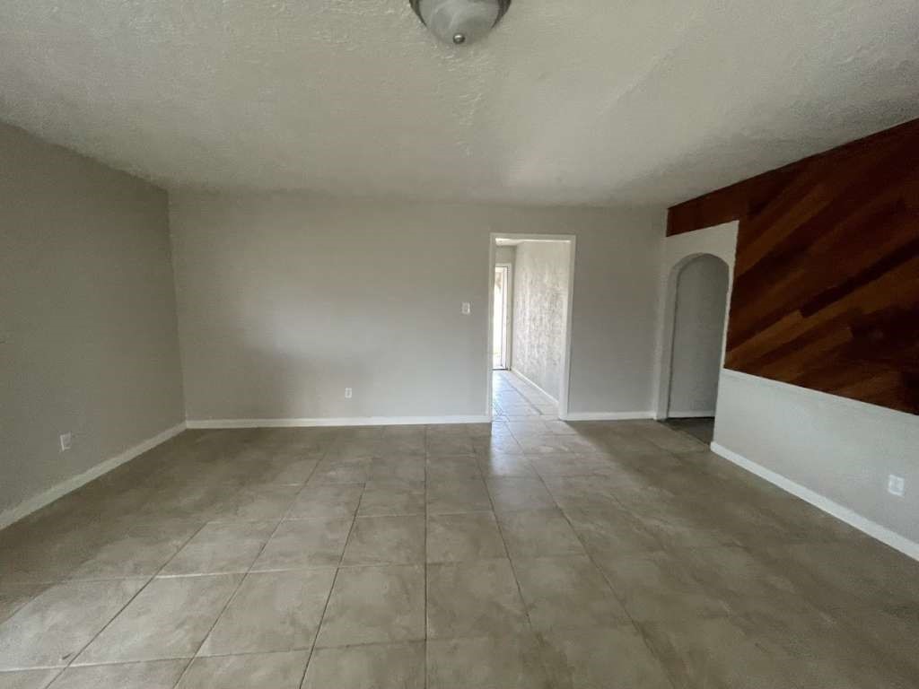 2310 Heather Street Highlands, TX 77562 - Photo 3 of 16 a view of an empty room with windows
