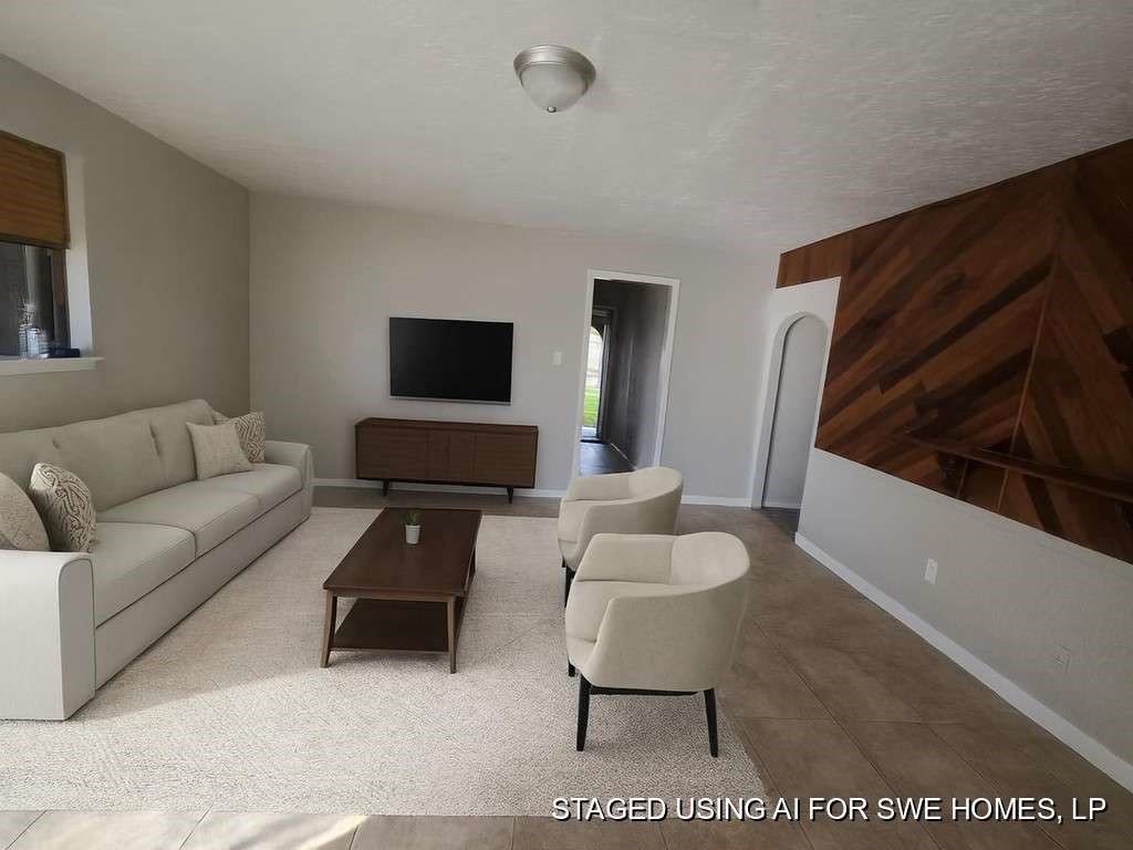 2310 Heather Street Highlands, TX 77562 - Photo 4 of 16 a living room with furniture and a flat screen tv
