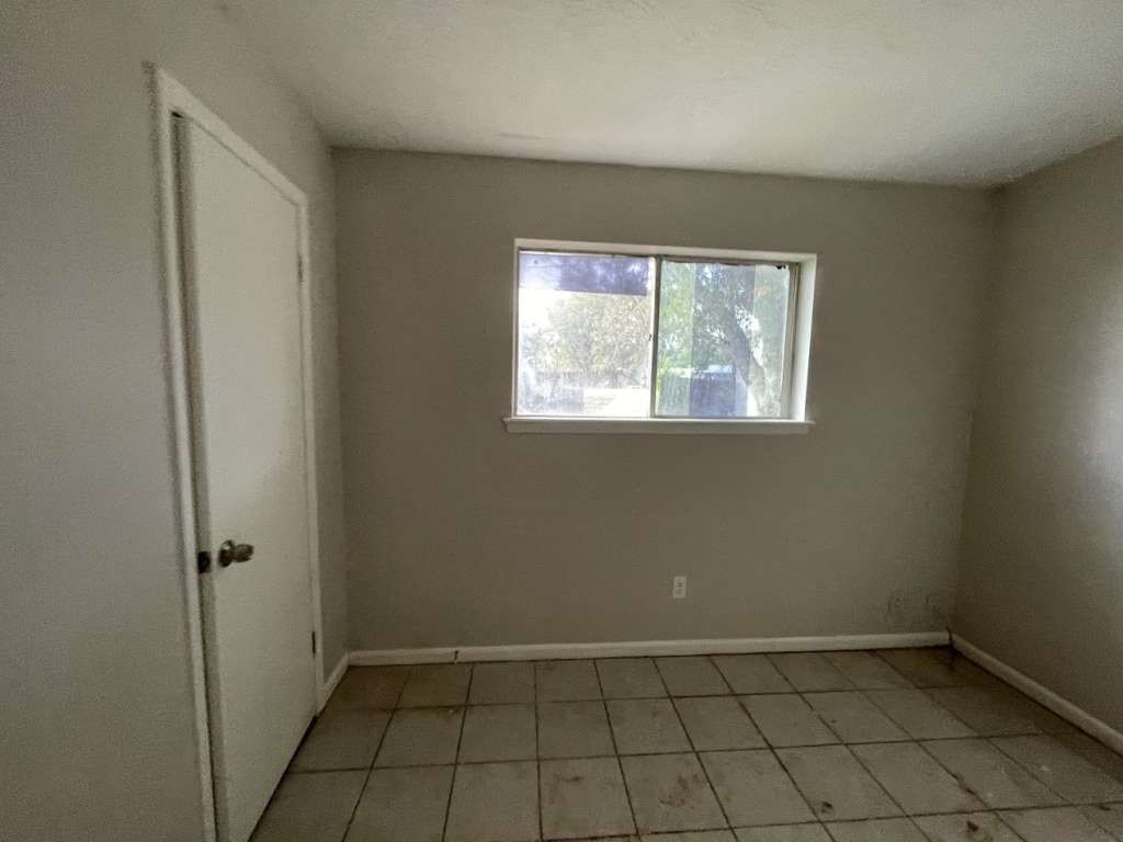 2310 Heather Street Highlands, TX 77562 - Photo 8 of 16 an empty room with windows