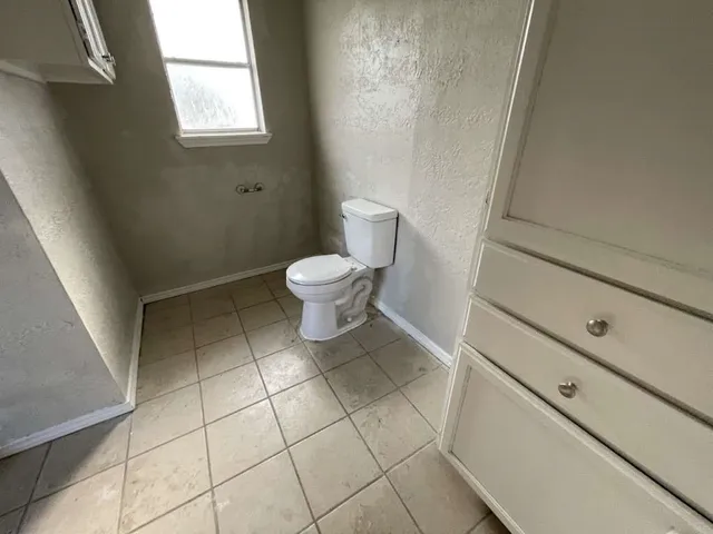 a bathroom with a toilet