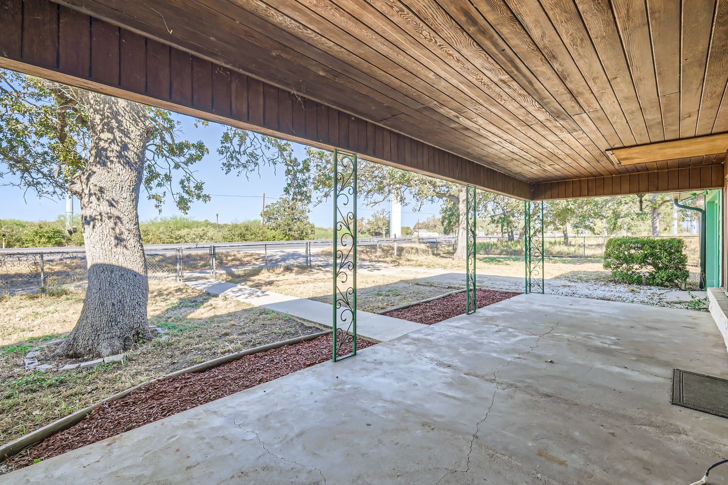 7348 Highway 183 Lockhart, TX 78644 - Photo 3 of 13 Fenced backyard with a patio area