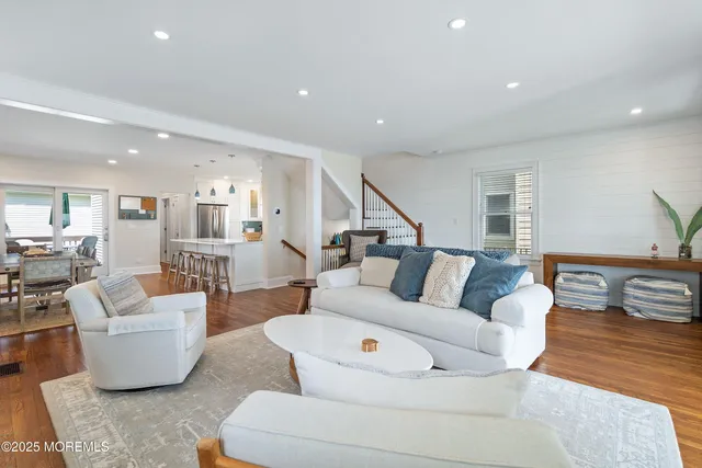 a living room with fireplace furniture and a flat screen tv