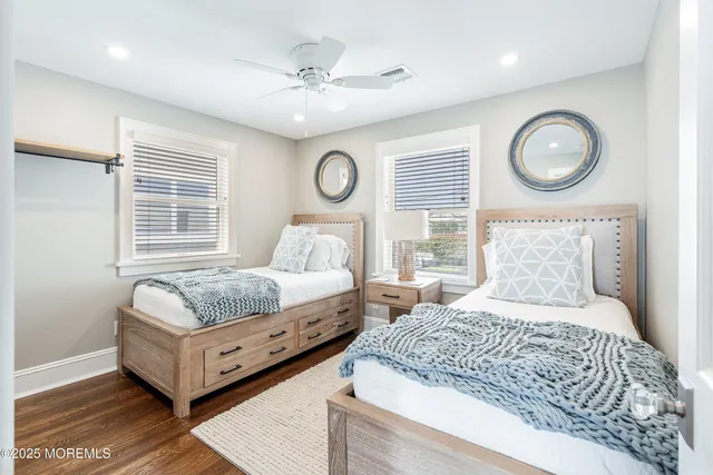a view of a patio with table and chairs with wooden floor and fence