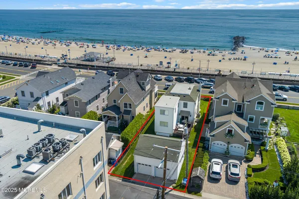 a view of a field with an ocean view