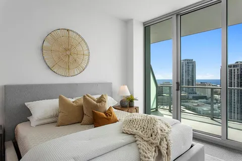 a living room with a large window and a table