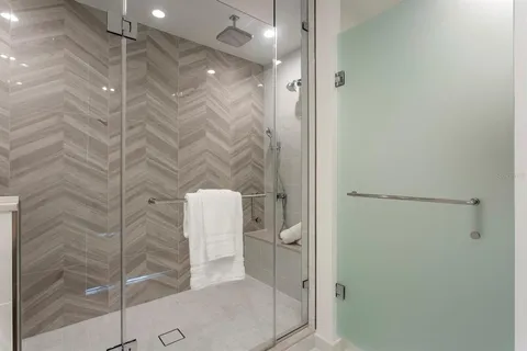a bathroom with a shower and toilet