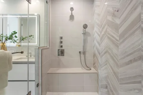 a bathroom with a bathtub and shower