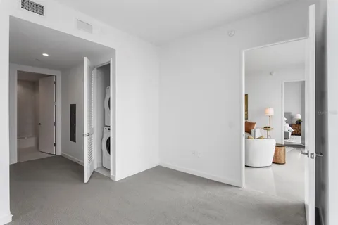 wooden floor and a utility room with a bathroom