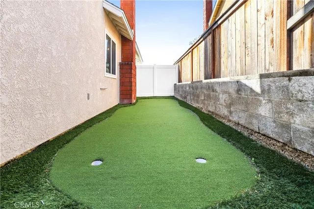 an aerial view of houses with an outdoor space