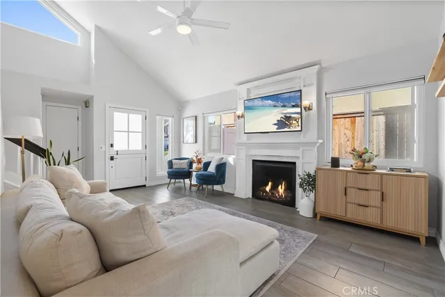 a room with table chair and windows