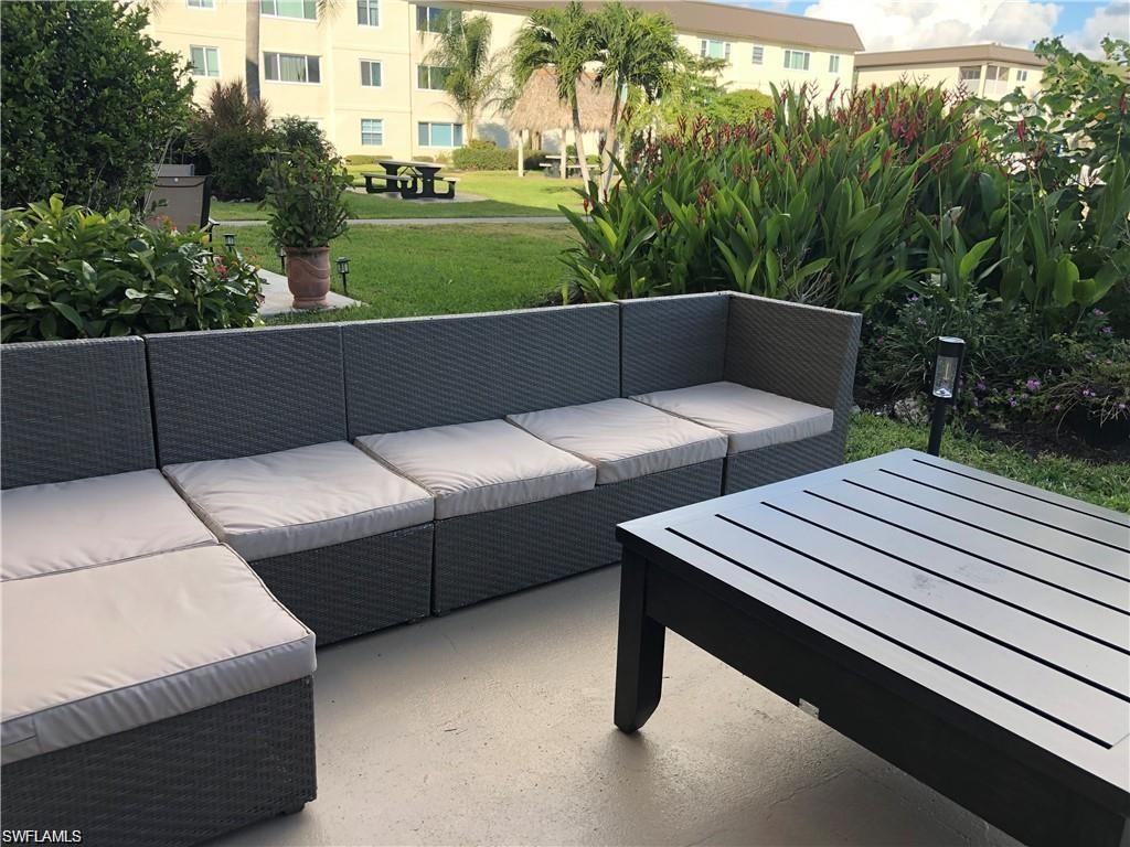 1000 Manatee Road, Unit A105 Naples, FL 34114 - Photo 12 of 22 a terrace view with sitting space and garden view