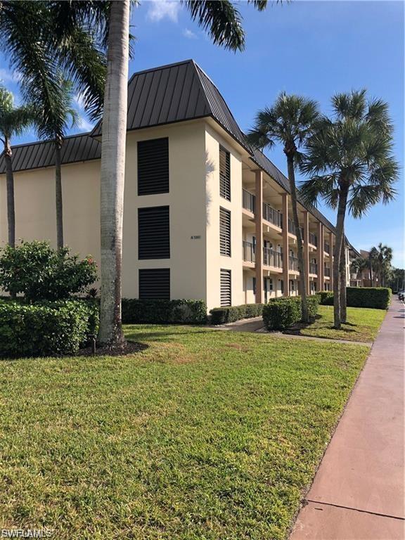 1000 Manatee Road, Unit A105 Naples, FL 34114 - Photo 22 of 22 a front view of a house with a yard