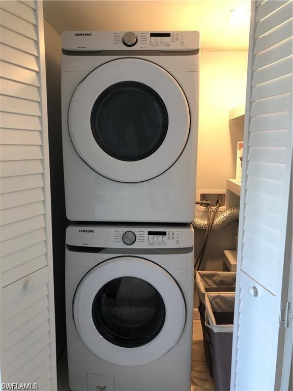 1000 Manatee Road, Unit A105 Naples, FL 34114 - Photo 10 of 22 a utility room with dryer and washer
