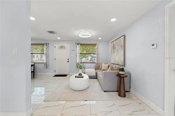 a living room with furniture and window