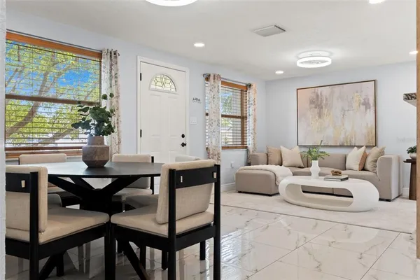 a living room with furniture and a large window