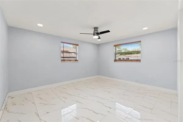 a view of an empty room with a window