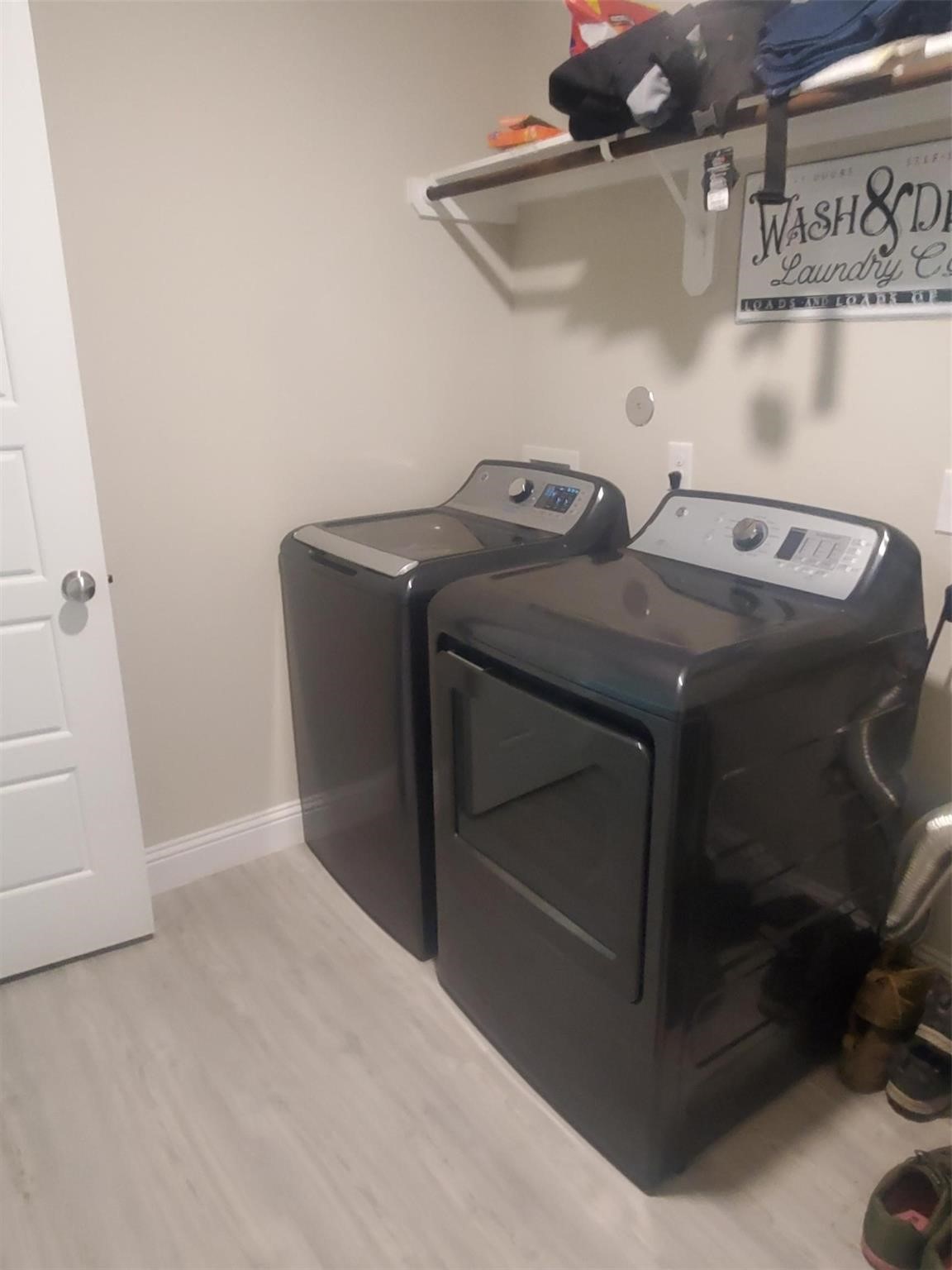 1208 Mare Stable Court Alvin, TX 77511 - Photo 14 of 19 a utility room with dryer and washer