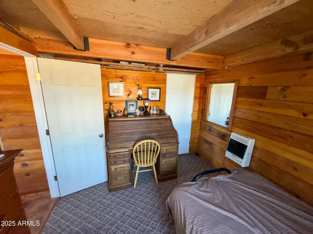 a bedroom with furniture and a window