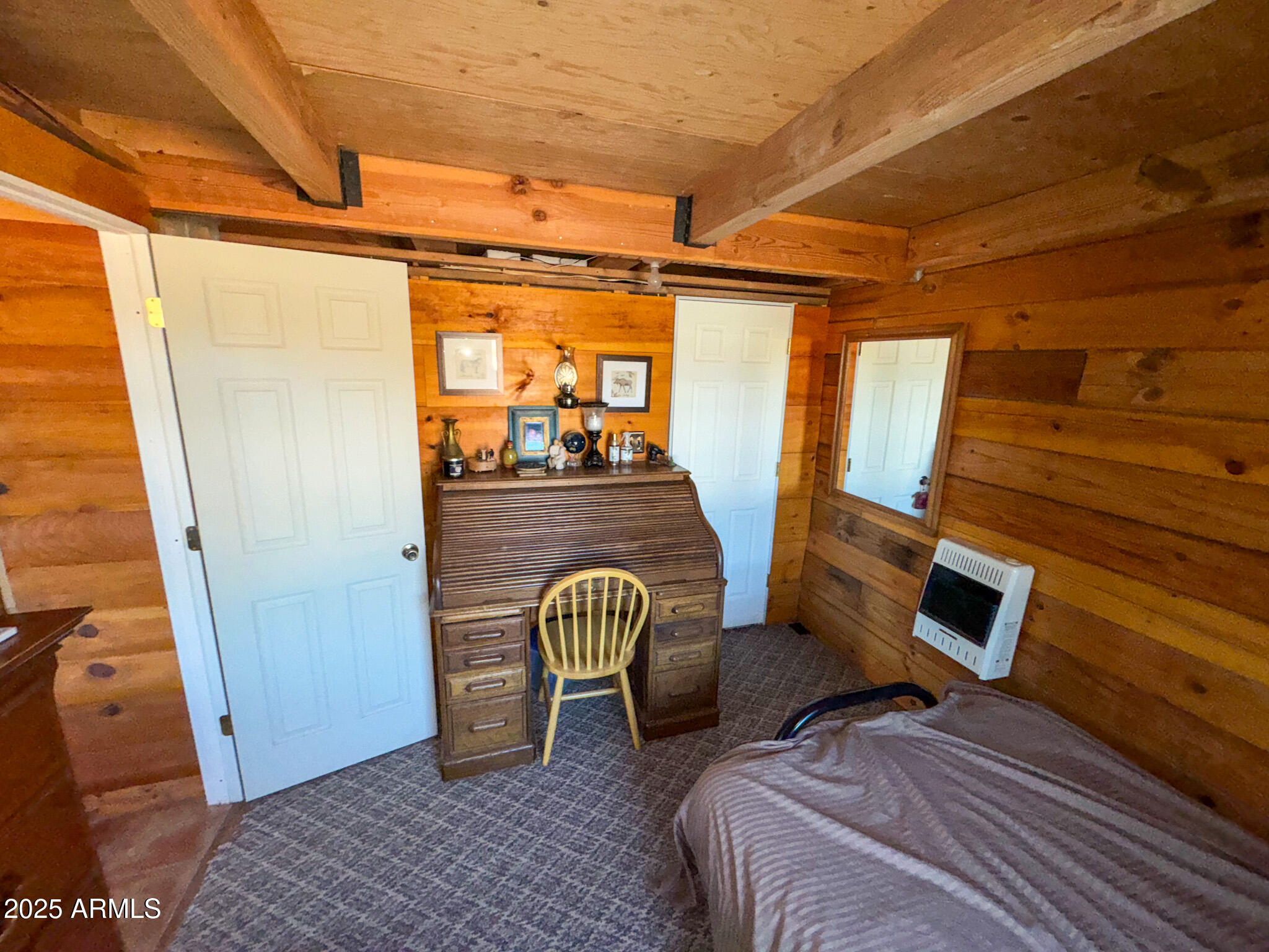 5823 North Cattle Guard Road Williams, AZ 86046 - Photo 28 of 37 a bedroom with furniture and a window