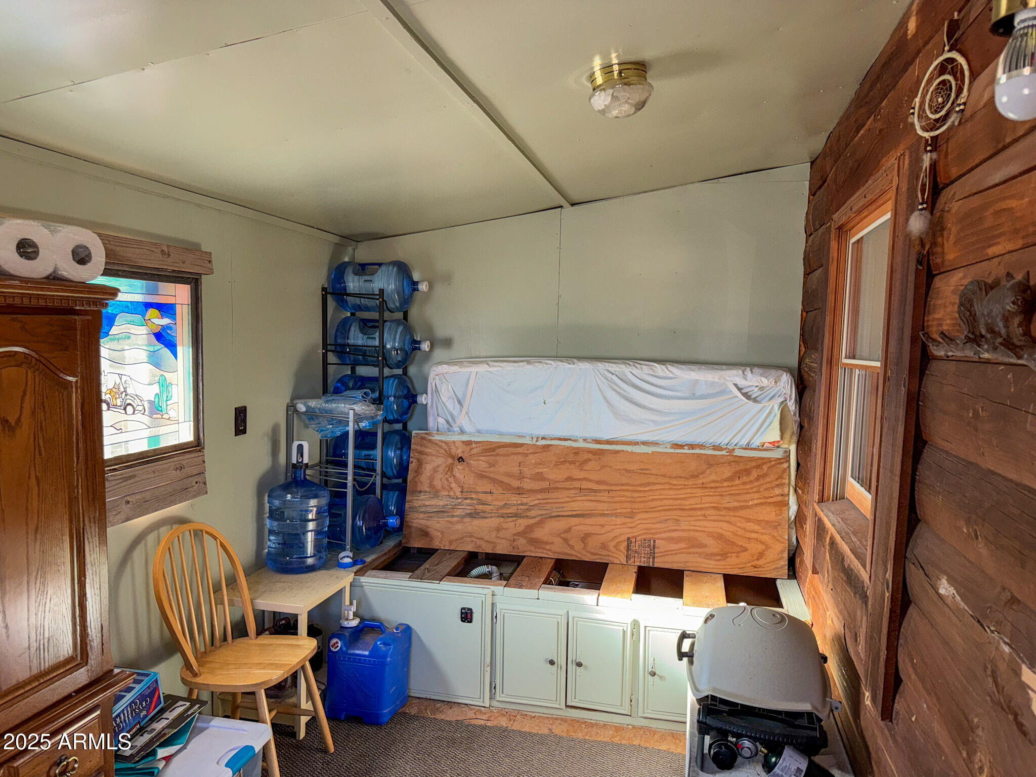 5823 North Cattle Guard Road Williams, AZ 86046 - Photo 30 of 37 a bedroom with furniture and a window