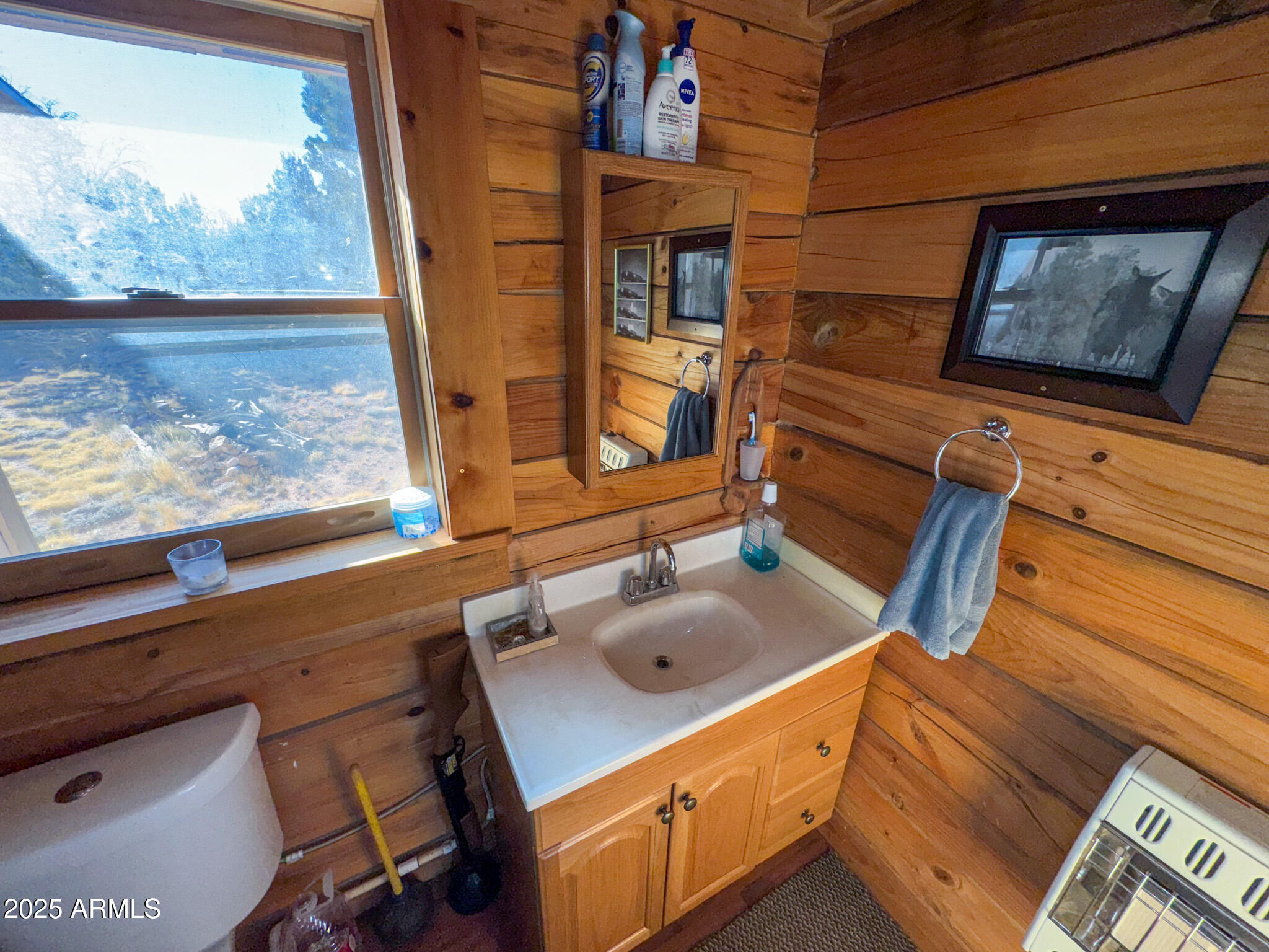 5823 North Cattle Guard Road Williams, AZ 86046 - Photo 31 of 37 a bathroom with a sink and a mirror