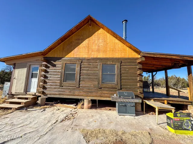 a view of a chairs and table in the patio