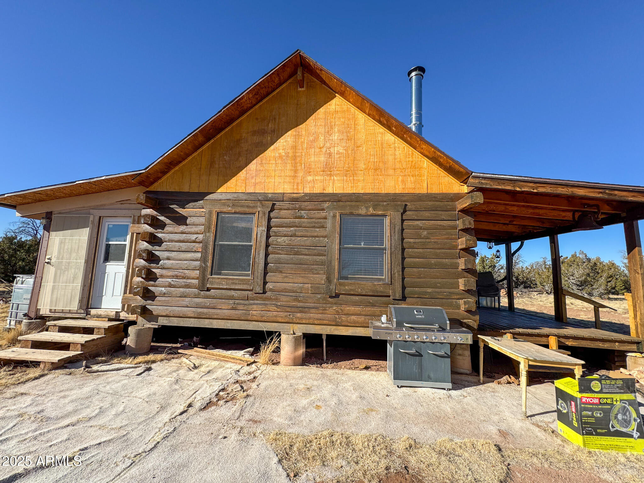 5823 North Cattle Guard Road Williams, AZ 86046 - Photo 8 of 37 a view of a house with a patio