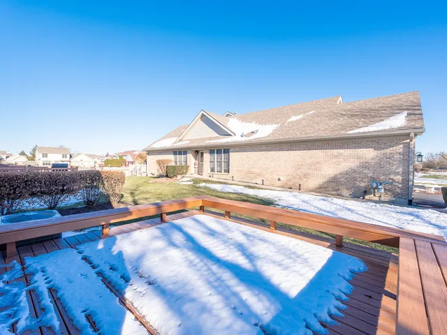a view of a house with swimming pool and sitting area