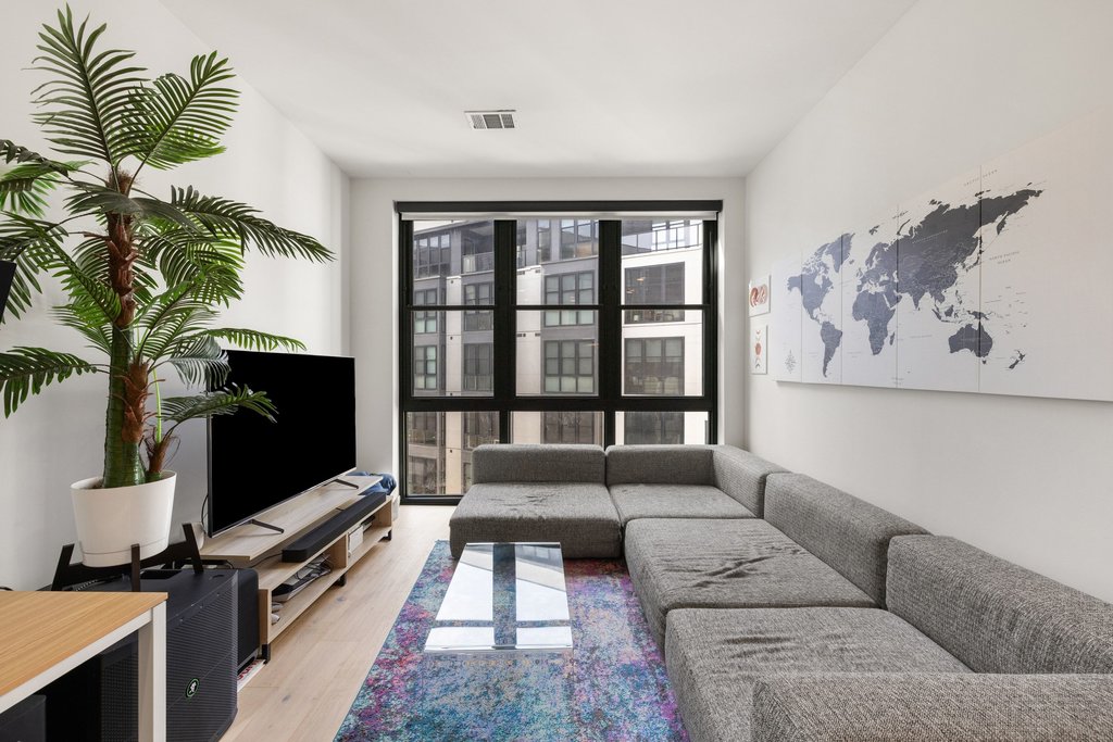 800 Embassy Drive, Unit 413 Austin, TX 78702 - Photo 1 of 27 Living room with light wood-style flooring