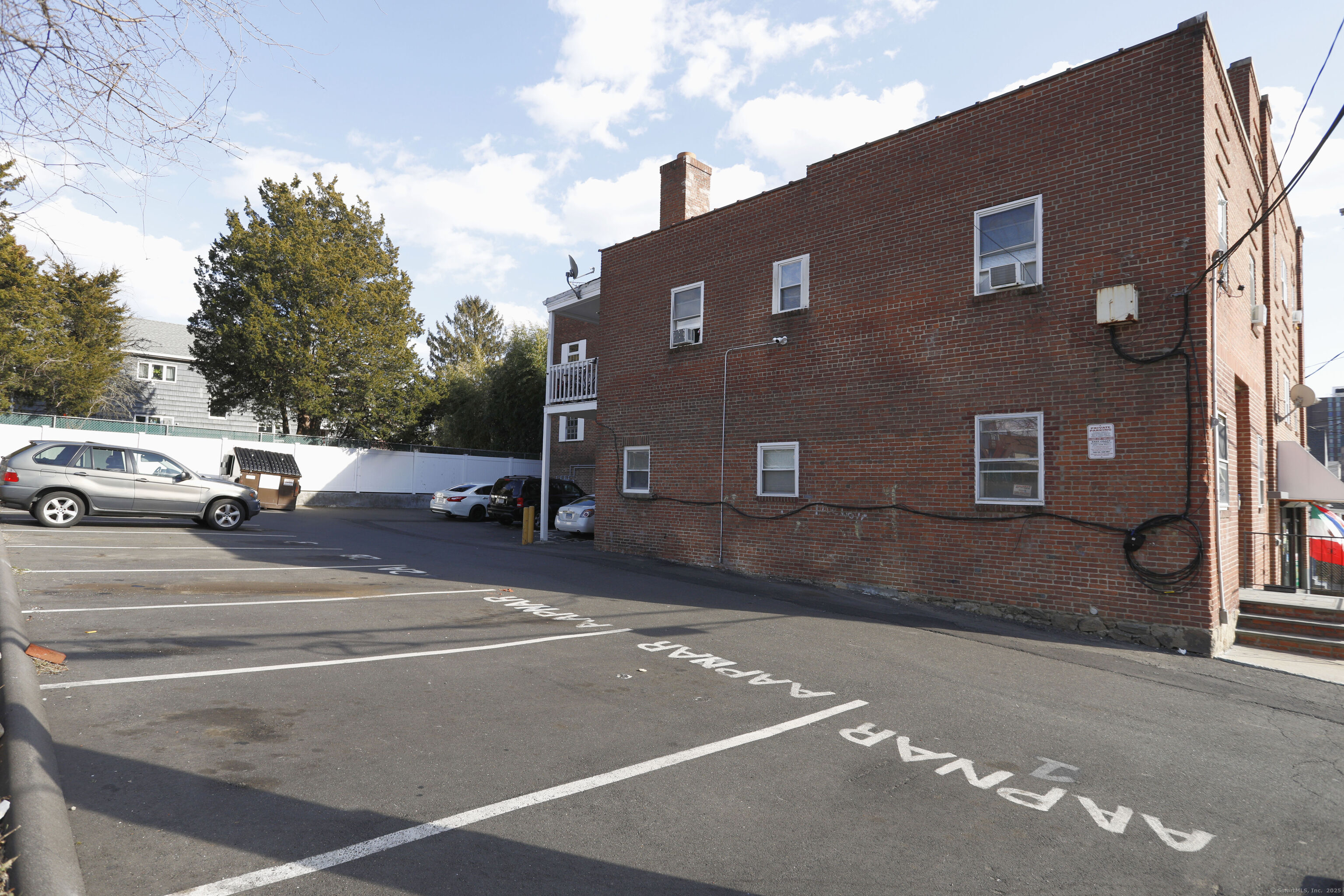 151 Spruce Street Stamford, CT 06902 - Photo 2 of 2 a view of a building with car parked on the road